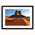 Framed desert landscape artwork with a black mat and frame, showcasing vibrant colors and intricate details, perfect for home decor and art enthusiasts.