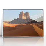 Framed acrylic artwork depicting a vibrant desert landscape with warm tones of orange and yellow, showcased in a sleek white frame, ideal for modern home decor.