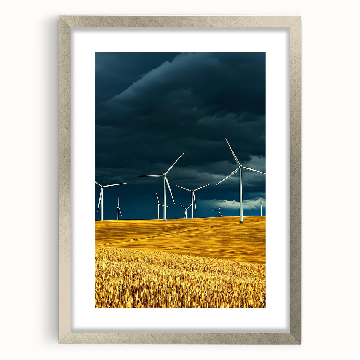 Framed landscape artwork featuring vibrant green fields and a silver mat border, ideal for home decor. The piece adds a touch of nature to any interior setting.