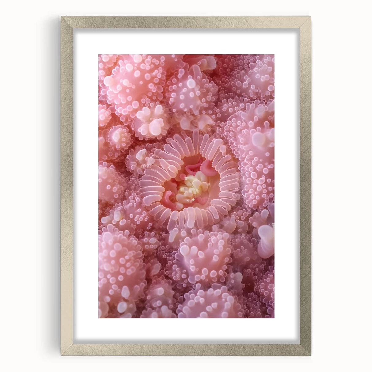 Textured art print featuring abstract nature elements in muted green and brown tones, framed in silver.