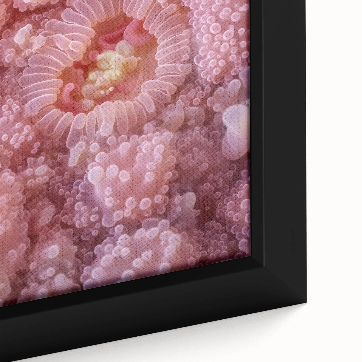 Close-up of textured black wall art featuring colorful nature elements on a framed canvas, ideal for living room decor.