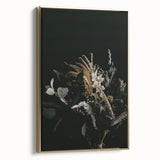 Framed canvas featuring a vintage-style landscape painting with fall foliage in muted gold and black.