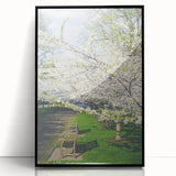 Large abstract wall art depicting spring, with vibrant green and yellow tones on a black framed acrylic.