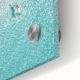 Large abstract wall art in vibrant orange and yellow tones on acrylic glass.