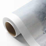 Winter scene with snow-covered trees on rolled canvas, in muted blue and gray tones, ideal for nursery wall art.