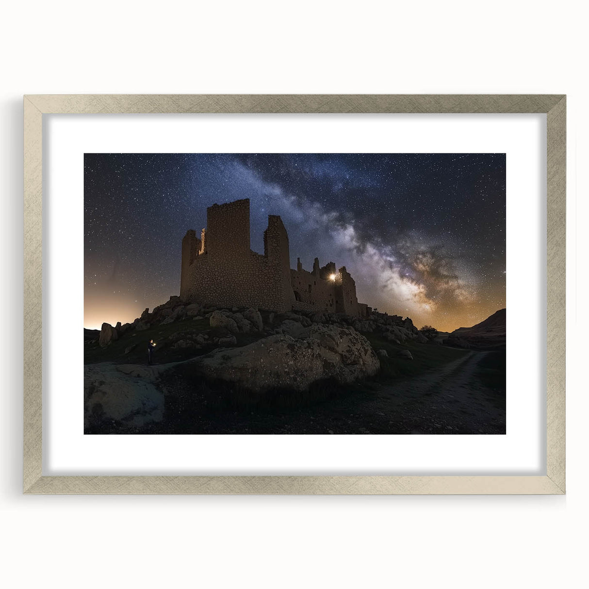 Elegant silver-framed landscape artwork depicting a majestic castle surrounded by lush greenery, highlighting intricate details and a sophisticated mat finish, perfect for home decor.