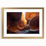Framed landscape artwork depicting a serene cave scene, featuring a gold mat and elegant frame, perfect for enhancing home decor and adding sophistication to any room.