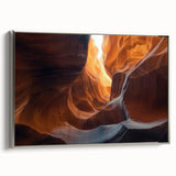 Framed canvas artwork depicting a serene landscape with intricate cave designs, showcasing silver accents and a side view that enhances its depth and elegance.