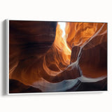 Framed canvas artwork showcasing a stunning cave landscape in earthy tones, elegantly displayed in a white frame, perfect for enhancing modern home decor.