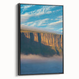 Framed canvas artwork showcasing a stunning cliff landscape, featuring vibrant colors and intricate details, set against a sleek black frame, ideal for modern decor.