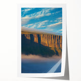 Vibrant rolled print of a stunning cliff landscape, showcasing dramatic rock formations and lush greenery, ideal for home decor or nature enthusiasts.