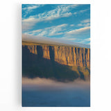 Vibrant stretched canvas artwork depicting a breathtaking landscape of rugged cliffs and a serene sky, perfect for enhancing any modern home decor.