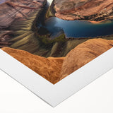 Vibrant rolled canvas artwork depicting a stunning landscape of canyons with rich colors and intricate details, ideal for home decor or art collectors.