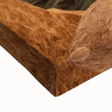 Close-up of a stretched canvas artwork depicting vibrant landscapes of canyons with rich textures and earthy tones, ideal for enhancing modern home decor.