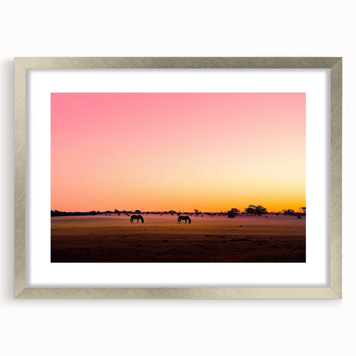 Framed landscape artwork depicting a serene countryside scene with a silver mat, providing an elegant touch to any home decor, ideal for nature lovers.