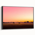 Framed canvas artwork showcasing a serene countryside landscape with lush greenery and rolling hills, featuring a sleek black frame and side view for enhanced display.