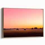 Framed canvas artwork showcasing a serene countryside landscape with vibrant green fields and a clear blue sky, complemented by an elegant gold frame for a sophisticated touch.