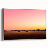 Framed canvas artwork of a serene countryside landscape with rolling hills and a vibrant sky, showcased in a sleek silver frame from the side view, perfect for home decor.