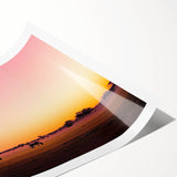 Rolled print showcasing a picturesque countryside landscape with lush green fields and distant hills, elegantly packaged in a protective cardboard tube for safe transport.