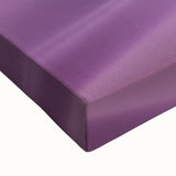 Close-up view of a stretched canvas featuring a vibrant desert landscape design, showcasing rich earthy tones and intricate details, perfect for home decor.