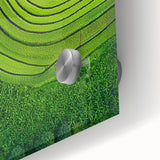 Close-up of a vibrant acrylic painting depicting colorful fields and landscapes, showcasing intricate details and textures that enhance its artistic appeal.