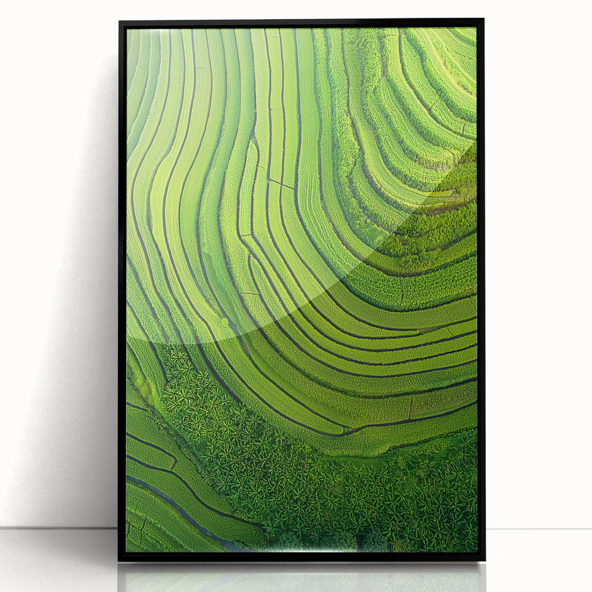 Framed acrylic artwork showcasing a vibrant landscape of lush green fields under a clear blue sky, presented in a sleek black frame, perfect for home decor.