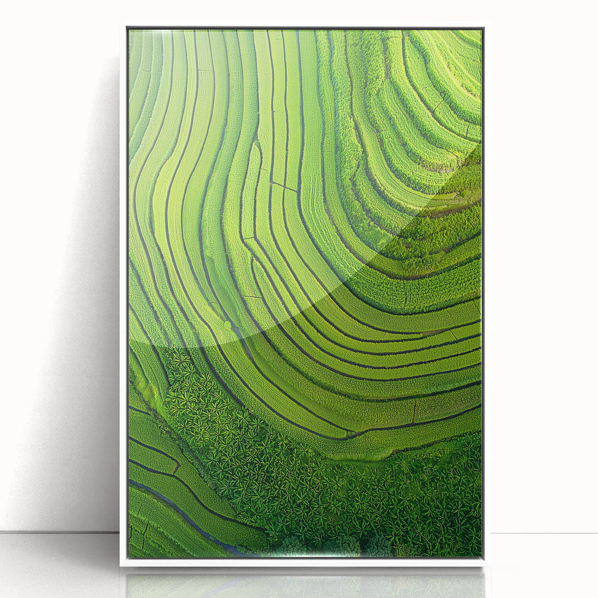 Framed acrylic artwork showcasing vibrant green landscapes with rolling fields, set in a sleek white frame, perfect for enhancing modern home decor.