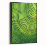 Framed canvas artwork depicting serene landscapes and fields, featuring a black frame and side view, perfect for enhancing home decor with nature-inspired aesthetics.