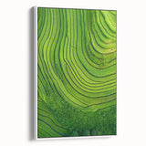 Framed canvas showcasing a serene landscape of rolling fields under a clear blue sky, elegantly displayed with a white frame, ideal for home decor.
