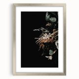 Textured art of abstract shapes in warm autumn hues on a framed silver canvas, suitable for bedroom decor.