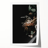 Rolled canvas print depicting a fall-themed floral design in subdued orange and brown tones.