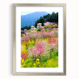 Textured abstract art print depicting spring, in muted green and yellow tones, framed in silver, suitable for bedroom decor.