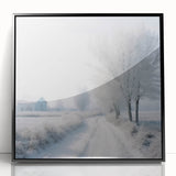 Large abstract wall art depicting a winter scene in muted blue and white tones, framed in black acrylic.