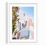 Abstract art print featuring swirling blue and white patterns, framed in white, suitable for bedroom or dining room decor.