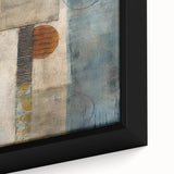 Close-up of a framed canvas wall art piece featuring abstract strokes in vibrant hues of blue, orange, and yellow, perfect for modern home decor.