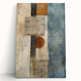 Abstract canvas wall art showcasing vibrant strokes in blue, orange, and yellow hues, elegantly leaning against a white wall, perfect for modern home decor.