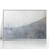 Framed wall art featuring abstract strokes in shades of blue, gray, and white, showcasing a modern artistic design that enhances contemporary home decor.