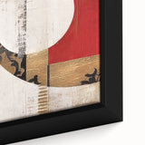 Close-up of a framed canvas wall art piece featuring vibrant abstract strokes in shades of blue, orange, and green, perfect for modern home decor.