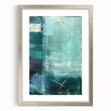 Abstract wall art featuring layered strokes in shades of blue, gray, and gold, framed in a sleek silver frame with a white mat, ideal for modern decor.