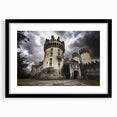 Black-framed landscape artwork featuring a majestic castle surrounded by lush greenery, designed with a mat for a polished presentation. Ideal for home decor.