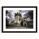 Black-framed landscape artwork featuring a majestic castle surrounded by lush greenery, designed with a mat for a polished presentation. Ideal for home decor.