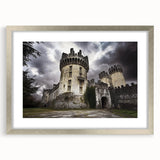 Silver-framed landscape artwork depicting a serene castle scene, featuring intricate details and a matted finish, ideal for home decor enhancement.