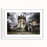 Elegant white-framed landscape artwork showcasing a majestic castle set against a serene backdrop of rolling hills, perfect for enhancing home decor and adding a touch of sophistication.