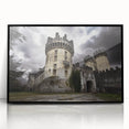 Framed acrylic print showcasing a stunning landscape with a majestic castle, set against a vibrant sunset, featuring intricate details and a sleek black frame, ideal for home decor.