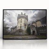 Framed acrylic print showcasing a stunning landscape with a majestic castle, set against a vibrant sunset, featuring intricate details and a sleek black frame, ideal for home decor.