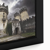 Close-up of a framed canvas artwork depicting a vibrant landscape with a majestic castle surrounded by lush greenery, showcasing intricate details and rich colors, ideal for home decor.