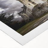 A beautifully rolled canvas showcasing a scenic landscape with a majestic castle surrounded by lush greenery, designed for wall decor. Perfect for adding elegance to any room.
