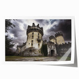 Rolled print showcasing a picturesque landscape with a majestic castle surrounded by lush greenery and vibrant flowers, perfect for home decor enhancement.