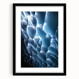 Framed landscape artwork depicting a serene cave scene with a black mat, offering a sophisticated touch to home decor. Ideal for nature enthusiasts and art lovers.