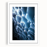 Framed landscape artwork showcasing a serene cave scene, featuring earthy tones and intricate details, complemented by a white mat for an elegant presentation. Perfect for enhancing home decor with a touch of nature-inspired art.